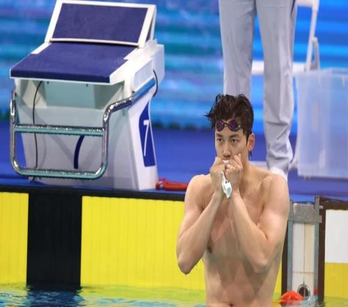 鏡頭內(nèi)外“過山車”式奪冠與泳池老兵的堅守